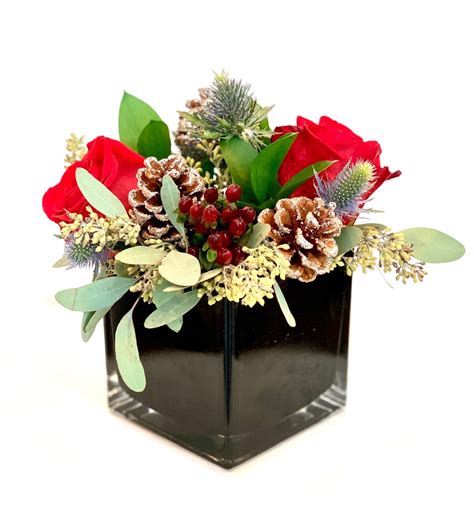 Holiday centerpiece with fresh flowers by Doral Orchids Florals & Events