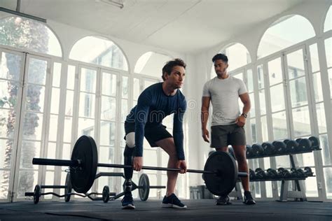 Disabled Athlete Weightlifting With His Coach In Modern Gym Man With