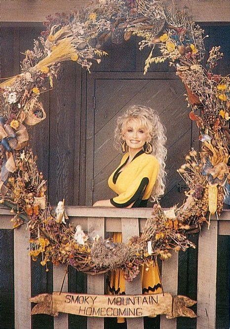 An Image Of A Woman Sitting In Front Of A Wreath