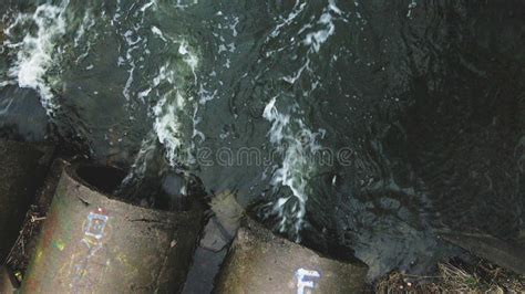 Streams Of Water Flow Through Concrete Pipes Polluted Body Of Water In The Park Stock Video