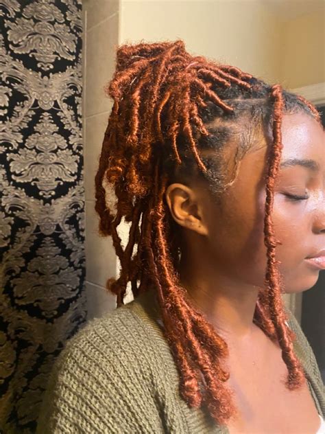 Black Girl With Shoulder Length Ginger Faux Locs In An Half Up Half