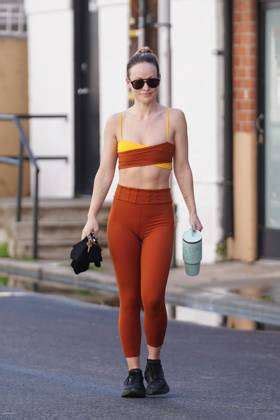 Olivia Wilde Shows Off Her Abs In A Red And Yellow Workout Ensemble As