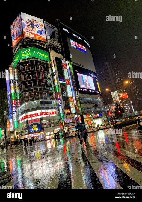 City street at night in the rain, Shinjuku, Tokyo Stock Photo - Alamy