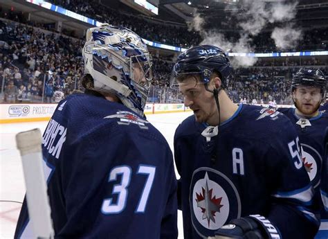 Winnipeg Mb February 18 Goaltender Connor Hellebuyck 37 And Mark