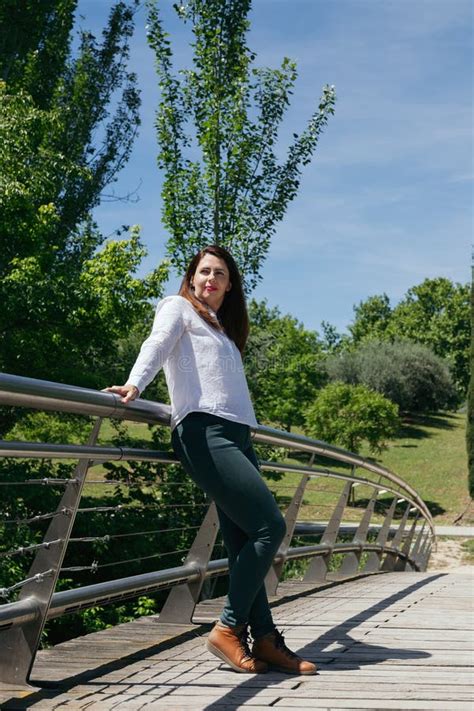 Mature Years Old Woman In Casual Clothes Resting Leaning On A Bridge