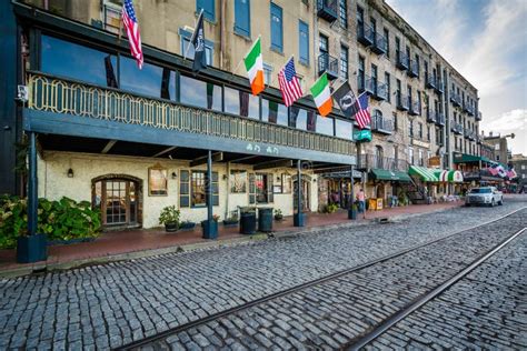 The Cobblestone River Street And Old Buildings In Savannah Georgia