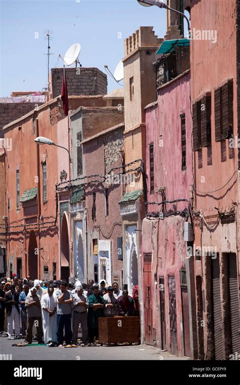 Muslims Praying In The Street Historic District Of Marrakech Morocco