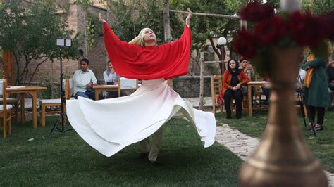 Young Afghan women, men perform whirling Sufi dance together