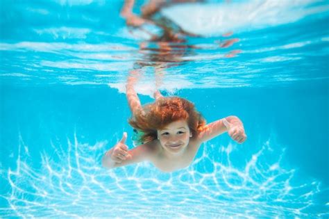 Premium Photo | Summer kids in water in pool underwater child swim and ...