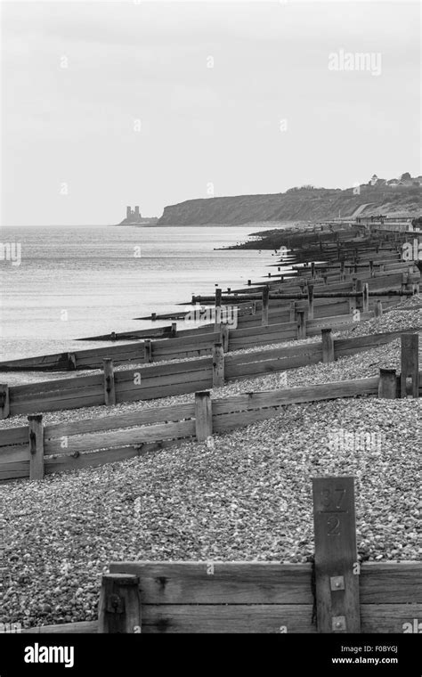 Groynes On Herne Bay Beach And Reculver Towers In The Distance Herne