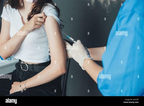 Doctor Giving A Patient Injection Subcutaneous In Arm Virus Protection