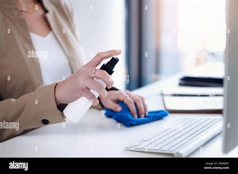 Keyboard Sanitize Woman Hand And Spray At A Desk For Bacteria Safety