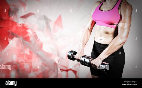 Composite Image Of Muscular Woman Lifting Heavy Dumbbells Stock Photo