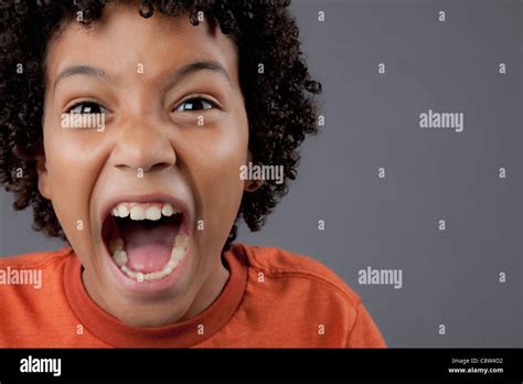 Studio Portrait Of Boy Screaming Stock Photo Alamy