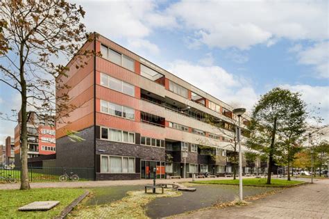 A Building With A Courtyard In Front Of It Editorial Photography