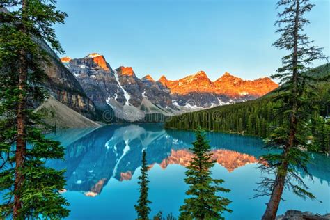 Golden Sunrise Over The Canadian Rockies At Moraine Lake In Canada