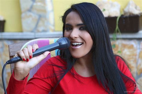 Busty Brunette Babe Valery Summer Has A Cam Shooting Her When She Plays With A Mic DefineBabe