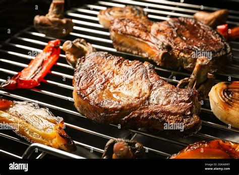 Tasty Steaks And Vegetables On Barbecue Grill Stock Photo Alamy