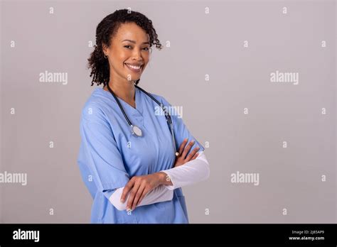 Portrait Of Happy African American Mid Adult Female Doctor With Arms