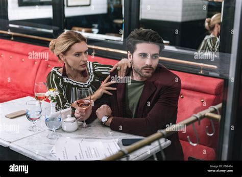 Uneasy Mature Woman Begging Man Stock Photo Alamy