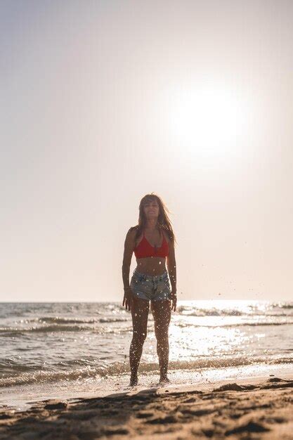 Premium Photo Woman Splashing In The Sea Water