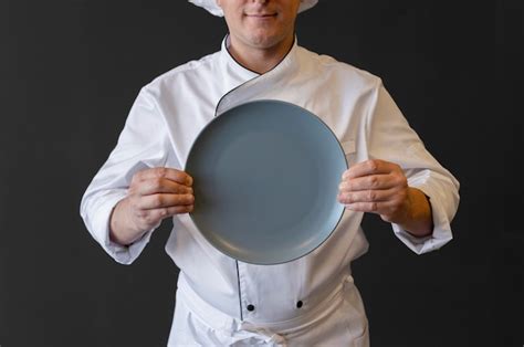 Free Photo Close Up Chef Holding Plate