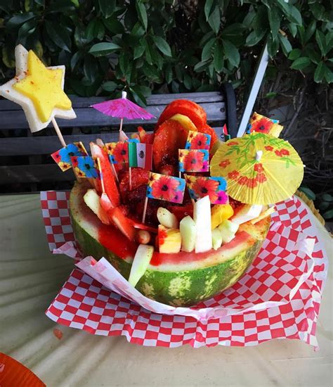 Luau Birthday Party Fruit Bowl Centerpieces Fruit Prepared By La Michoacana Ice Cream Parlor