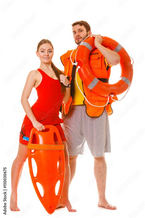 Lifeguards With Rescue Ring Buoy And Life Vest Photos Adobe Stock