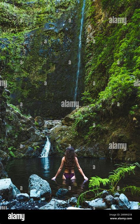 Description Tourist Woman In Bikini Enjoys A Refreshing Bath In The