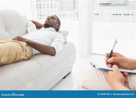 Man Lying On Sofa Talking To His Therapist Stock Image Image Of