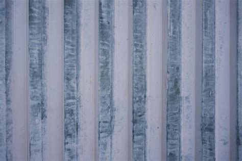 Premium Photo Iron Corrugated Fence Laced With White Paint