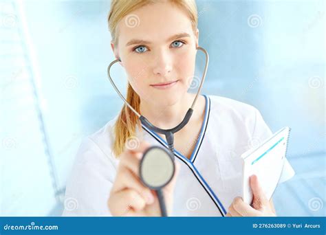 Regular Check Ups Ensures Good Health Portrait Of A Pretty Nurse