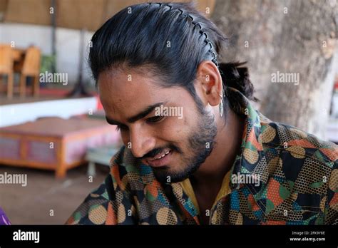 Portrait Of A Young Handsome Bearded Indian Male With Long Hair Wearing