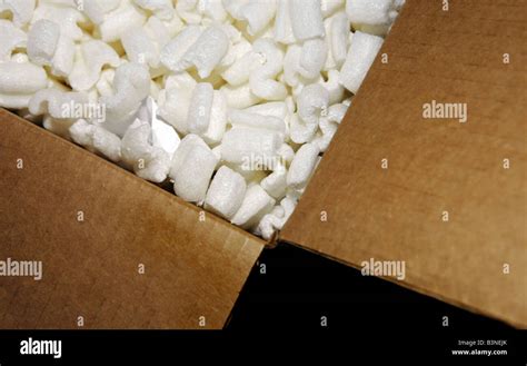 Packing peanuts in cardboard box Stock Photo - Alamy