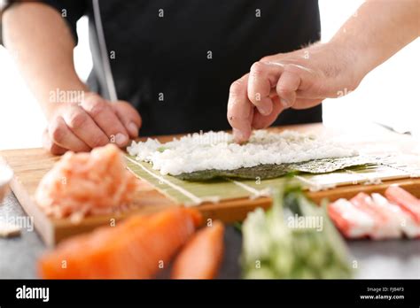 Sushi Master Preparing Sushi In Japanese Restaurant Japanese Cuisine