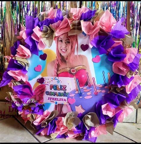 A Wreath Made Out Of Tissue Paper With A Photo On It