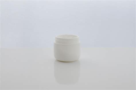 Premium Photo Jar With Cosmetic Cream On White Surface Moisturizing