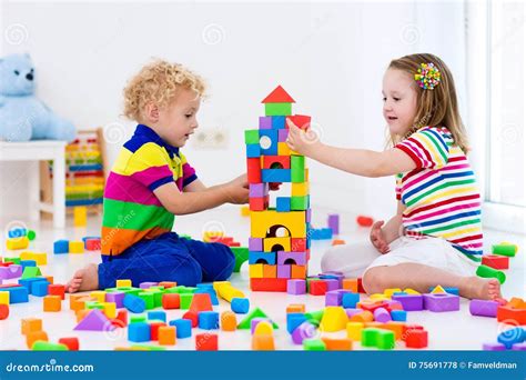 Kids Playing With Colorful Toy Blocks Stock Photo Image Of Care