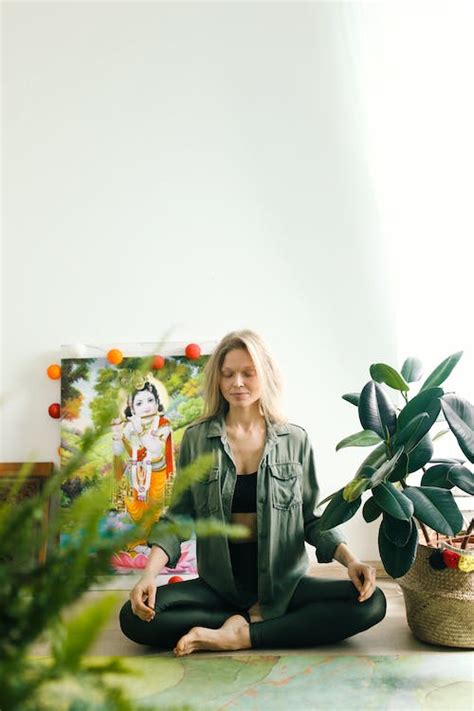 Person Sitting on the Floor Meditating · Free Stock Photo