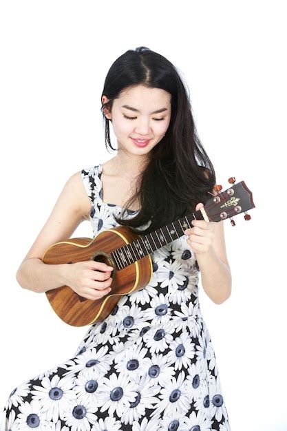 Premium Photo Attractive Asian Girl Playing Ukulele