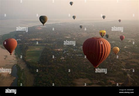An Aerial View Of A Group Of Hot Air Balloons Flying Over Bagan Myanmar Burma At Sunrise