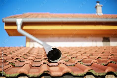 Water Spout On A House