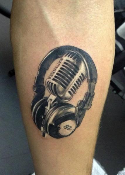 Tattoo by Tribo Tattoo Dj Tattoo, Guitar Tattoo, Music Tattoo Designs ...