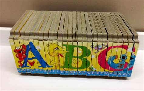 a stack of wooden blocks with the letters abc and c on them