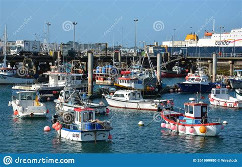 Colourful Small Fishing Boats Moored In A Busy Harbour At St Peter Port