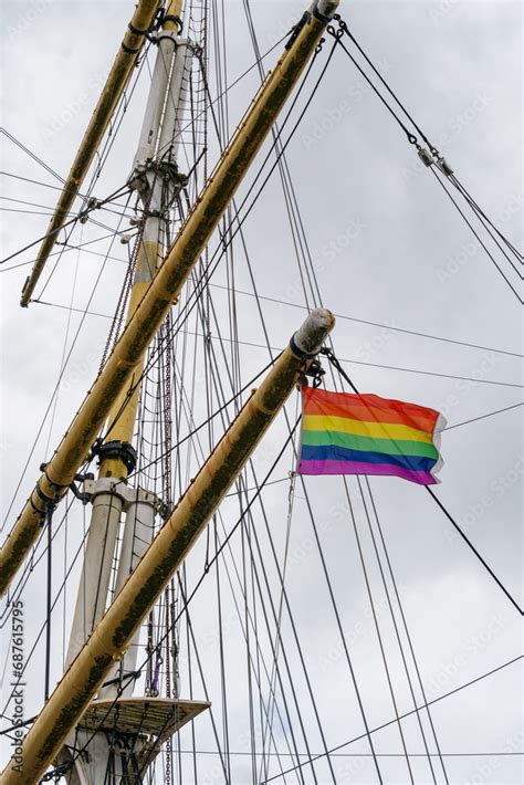 Historic ship mast and rigging with a rainbow pride flag flying Stock ...