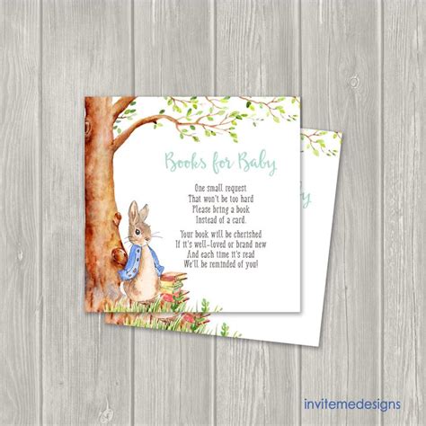 The Peter Rabbit Baby Shower Card Is Shown On A Wooden Background With