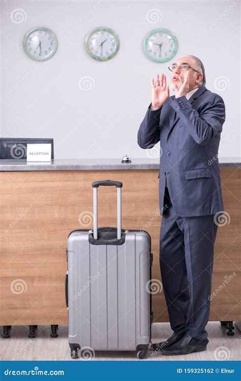 Old Businessman At The Hotel Reception Stock Photo Image Of Checkout
