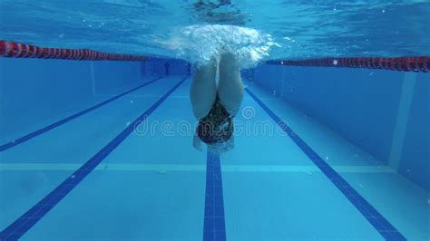 Sportswoman Swimmer In A Tracksuit In Diving Goggles In A Swimming