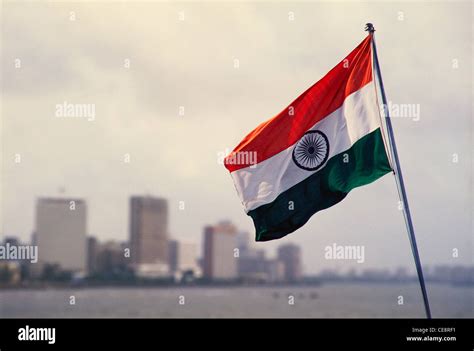 Indian flag flying ; bombay skyline ; bombay ; mumbai ; maharashtra ...